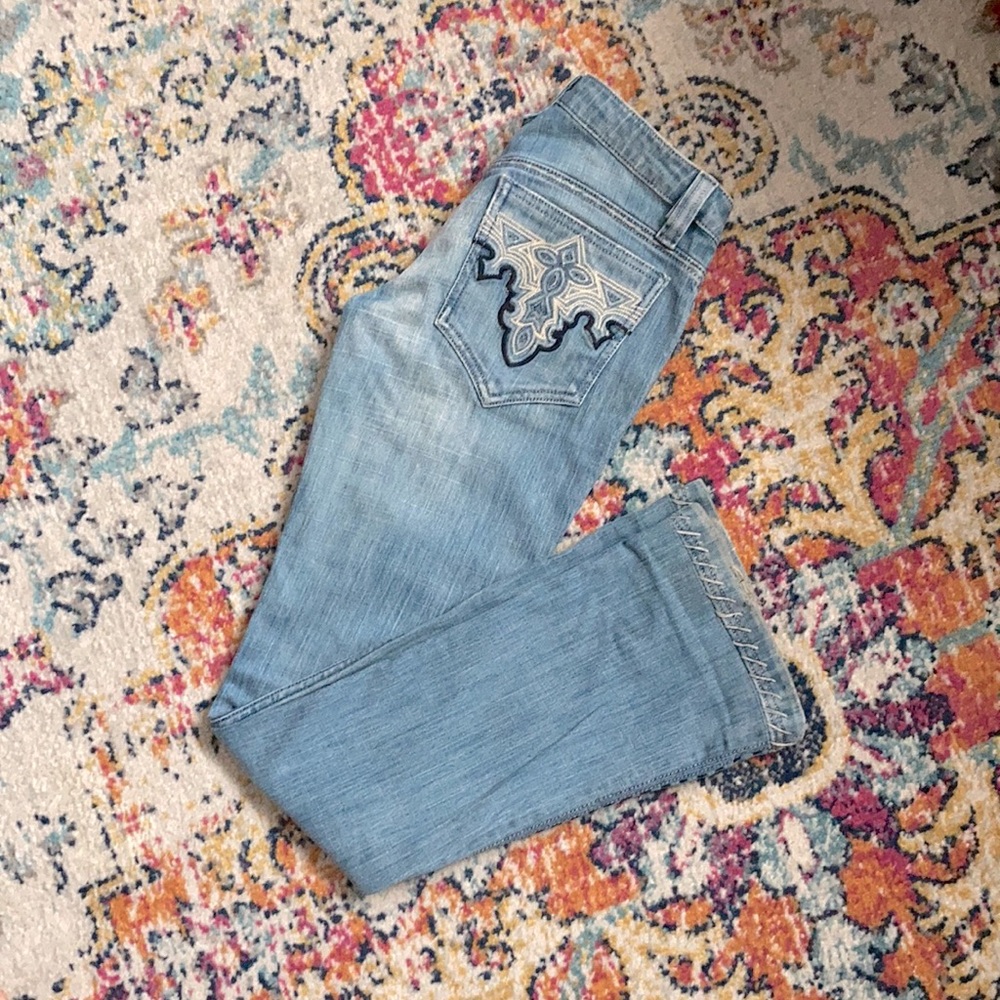 Antik Denim, size 25 boot cut jeans in medium/light blue.
